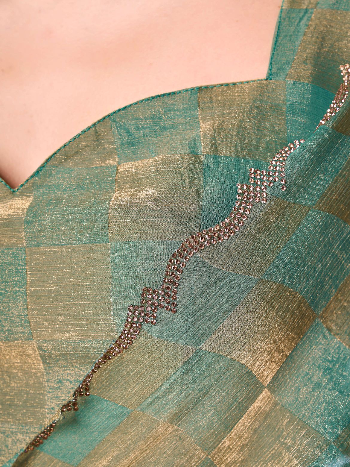 Checks pattern two tone green & golden colored designer saree with swaroski border